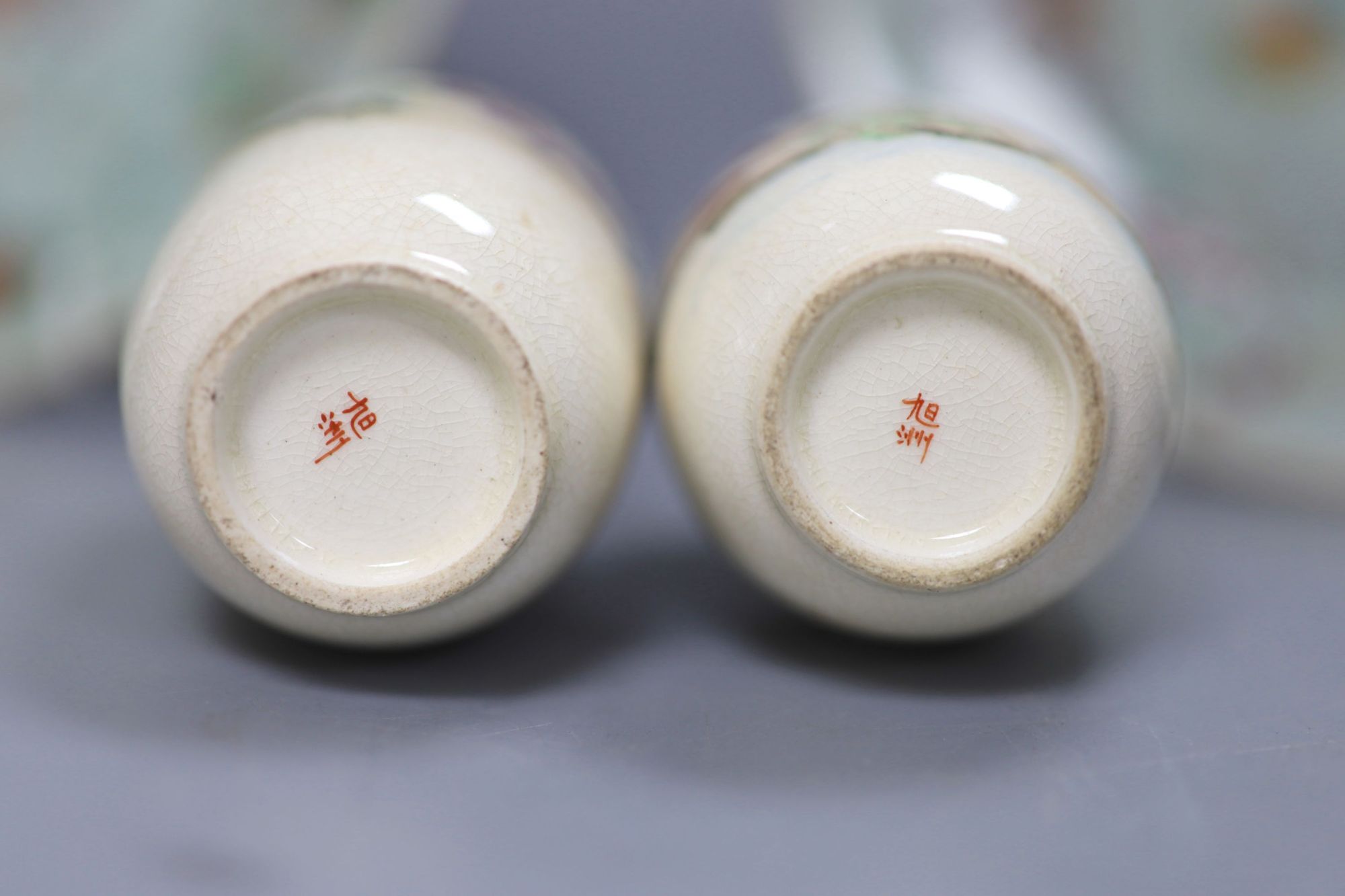 A pair of Cantonese celadon ground dishes, painted with birds and flowers, diameter 19cm, and a pair of Satsuma vases